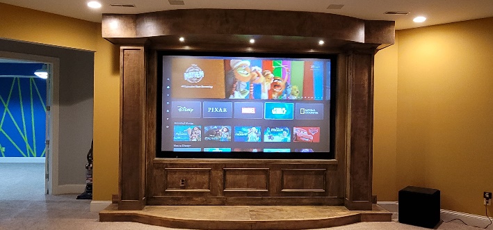 Acoustic-transparent projection screen detail in a Noble A-V dedicated theater